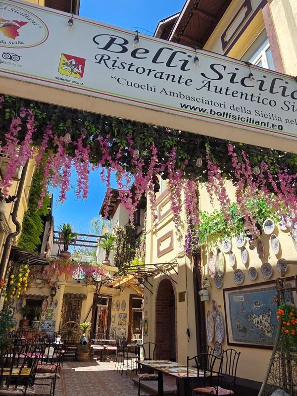 Belli Siciliani sign and courtyard